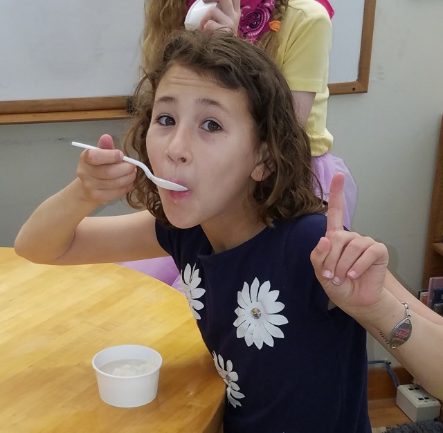 Francesca eating her first ice cream made by an ice cream shop! 